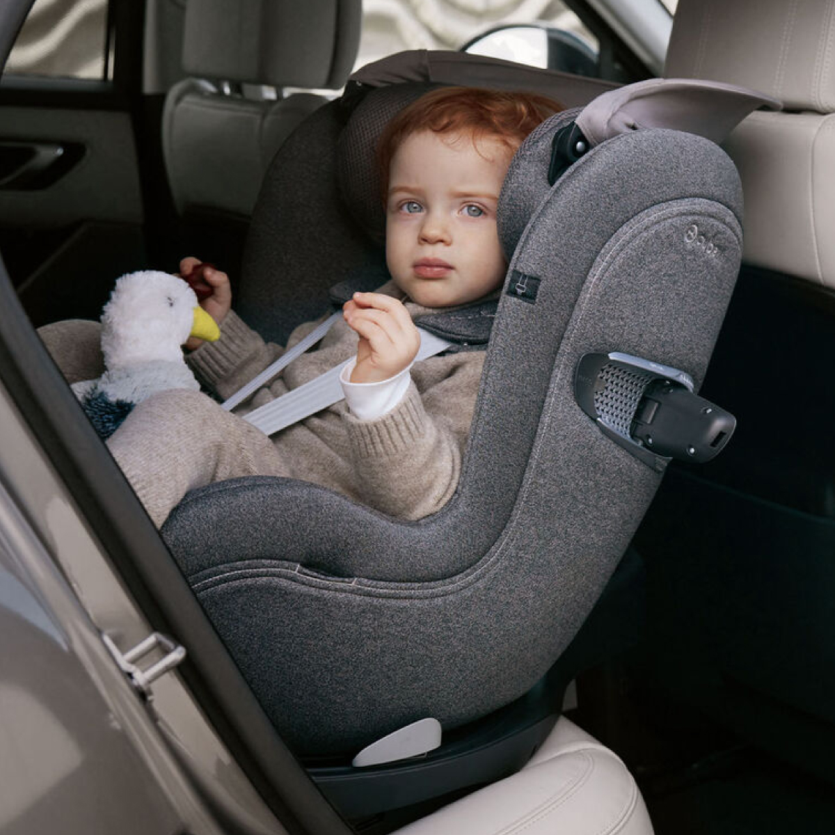 Toddler in rotating 360 degree car seat.