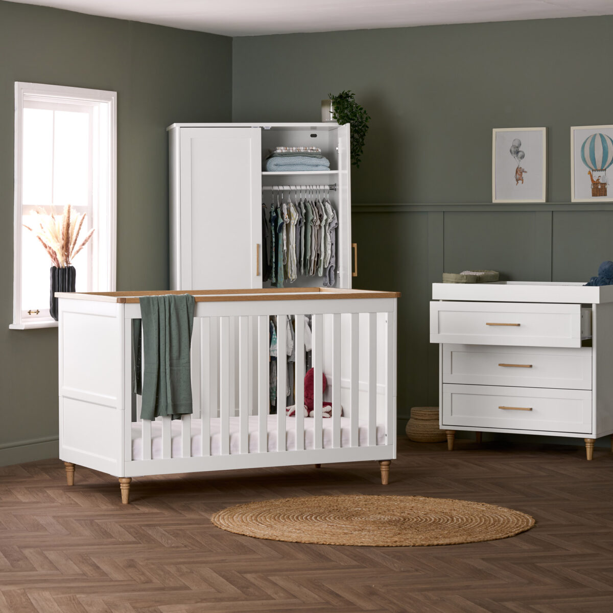 Obaby Orla 3 Piece Nursery Furniture Room Set in White with Natural with wardrobe doors open.