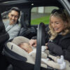 Parents & baby in the tiago car seat ready to make a car journey