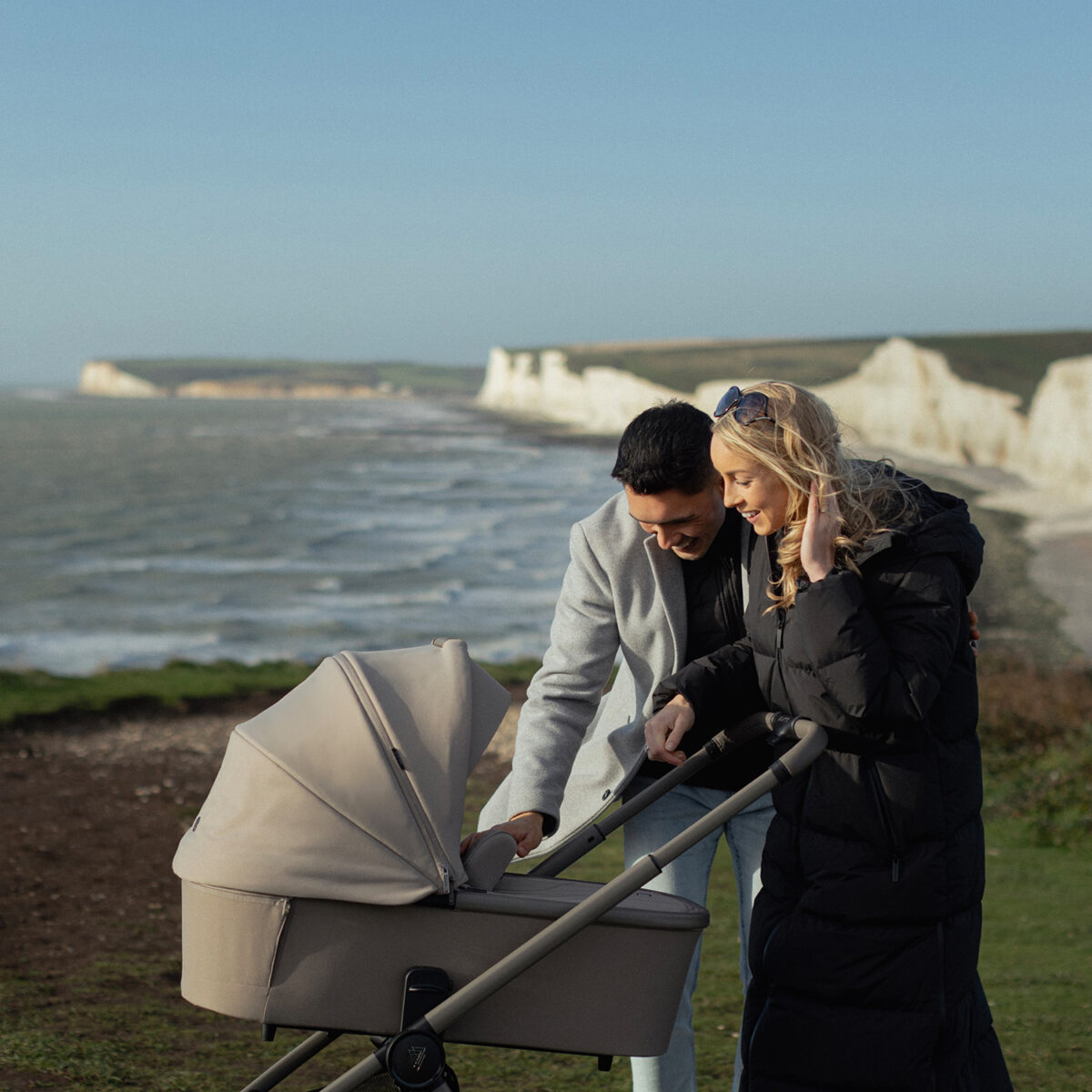 Parents out and about with their venicci upline 2 pushchair & carrycot