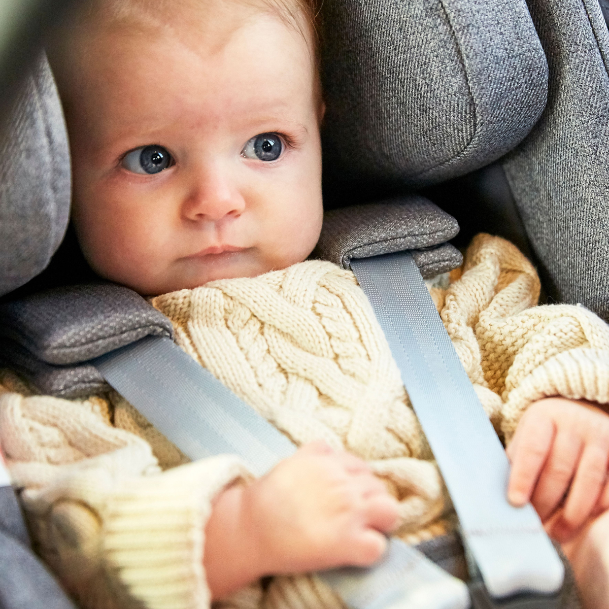 Baby strapped in to baby car seat